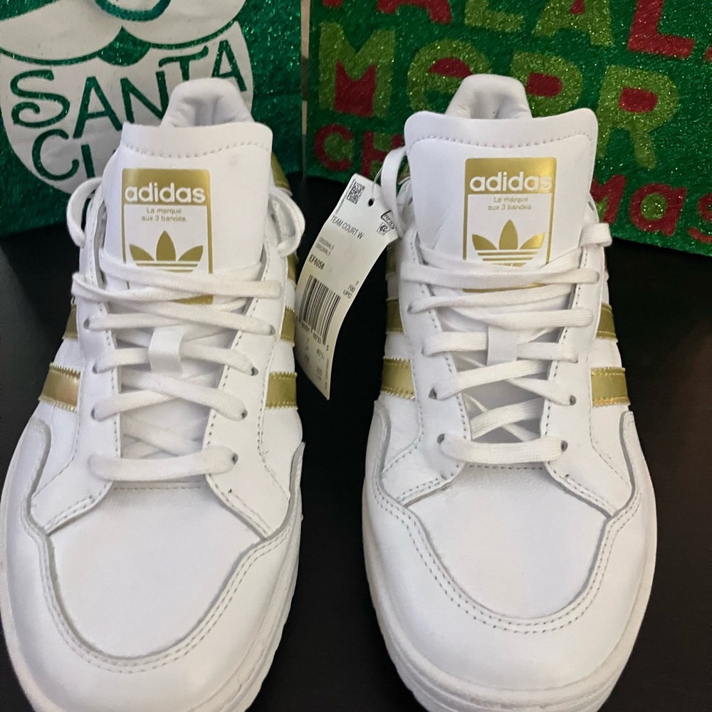 Adidas Womans White Sneakers with Gold Stripes